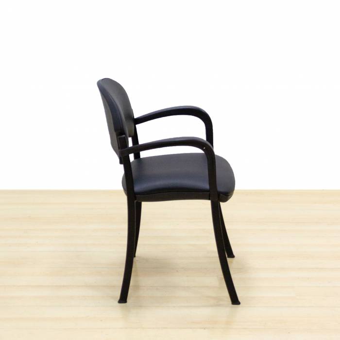 Confidant chair Mod. CLADE. Upholstered in black leatherette. Metallic structure.