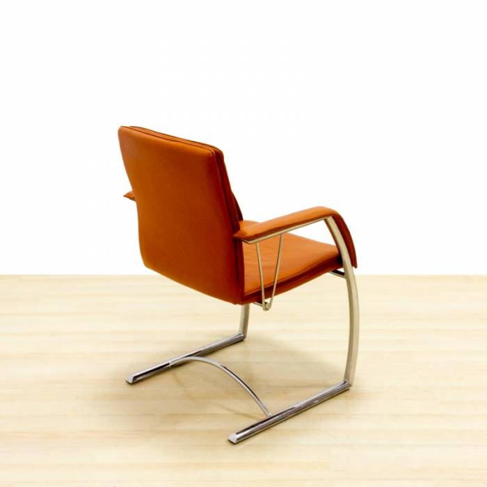 Confidant chair DYNAMOBEL Mod. DARIO. Upholstered in orange imitation leather. Skate base.
