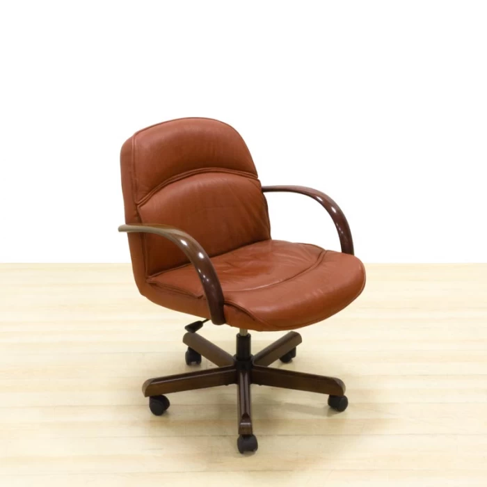 Operating chair Mod. HARD. Upholstered in brown leatherette. Wooden arms and swivel base.