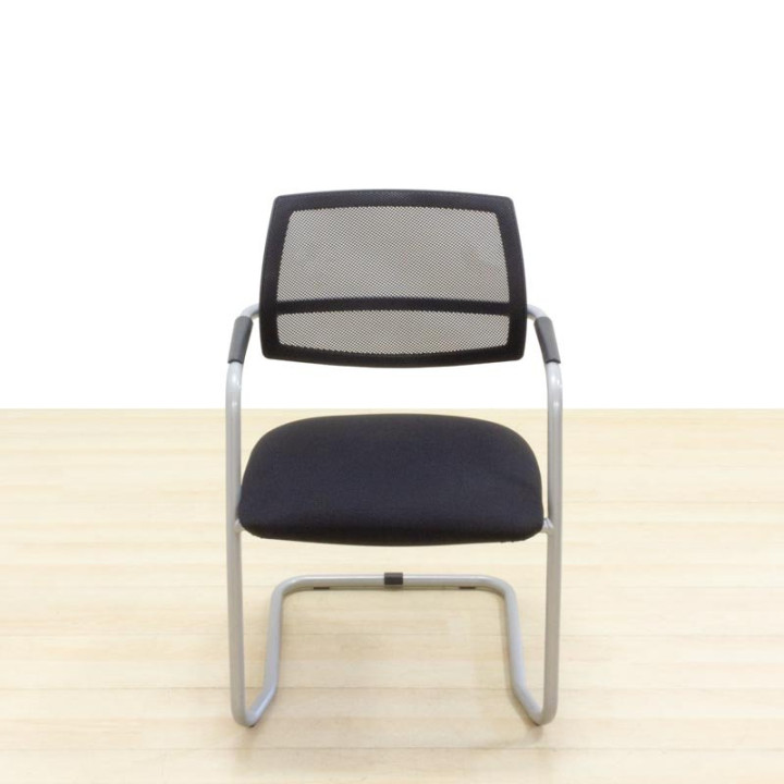 Confidant chair Mod. NERIO. Upholstered in black fabric. Skate base.