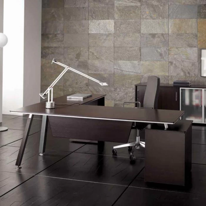 AT semi-direction table by HERPESA and auxiliary furniture.