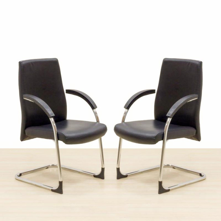 Confidant armchair Mod. ZAGREB. Upholstered in black imitation leather. Skate base.