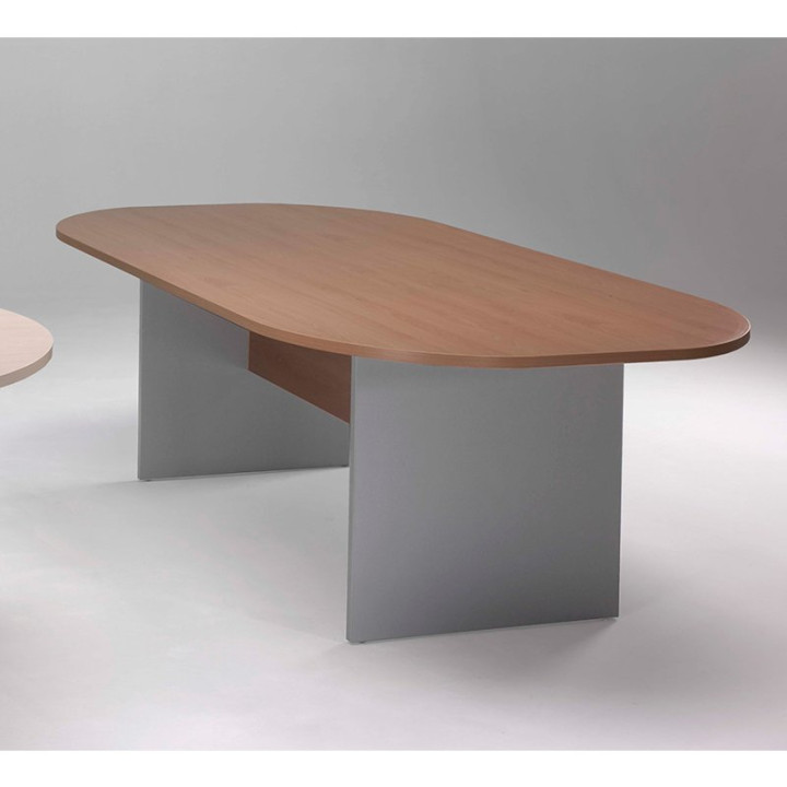 Mesa de reuniones ovalada de Herpesa en acabado madera, con base en H del mismo material y esquinas redondeadas.