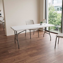 Mesa plegable de comedor en color blanco y estructura en acero negra.